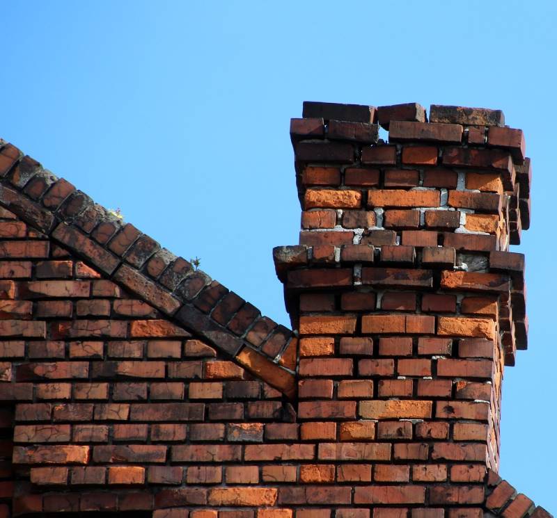 Signs Your Santa Ana Home Needs a Chimney Inspection Damaged chimney on an Santa Ana home showing cracks and missing mortar